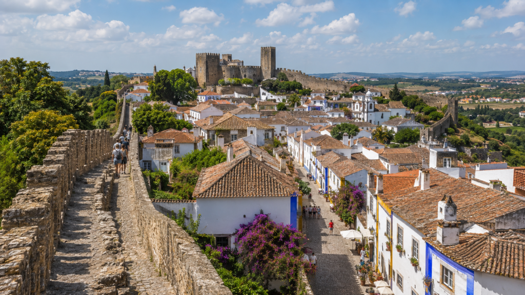 Medieval walls and whitewashed houses in Óbidos, Portugal