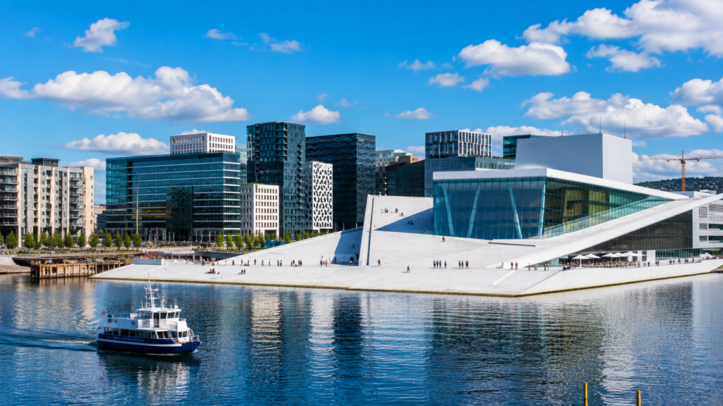 Oslo Opera House and modern waterfront skyline on a sunny day in Oslo, Norway