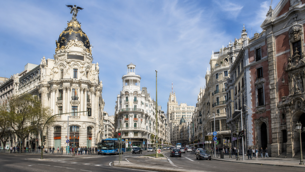 Historic buildings and lively streets along Gran Vía in Madrid, Spain