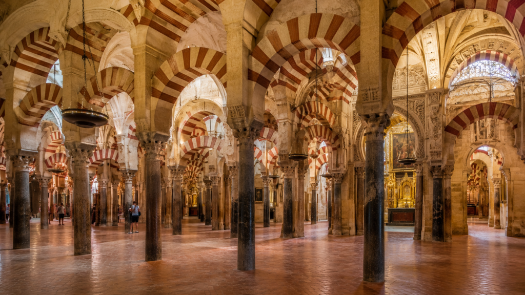 Red and white arches inside the Mosque-Cathedral of Córdoba, Spain